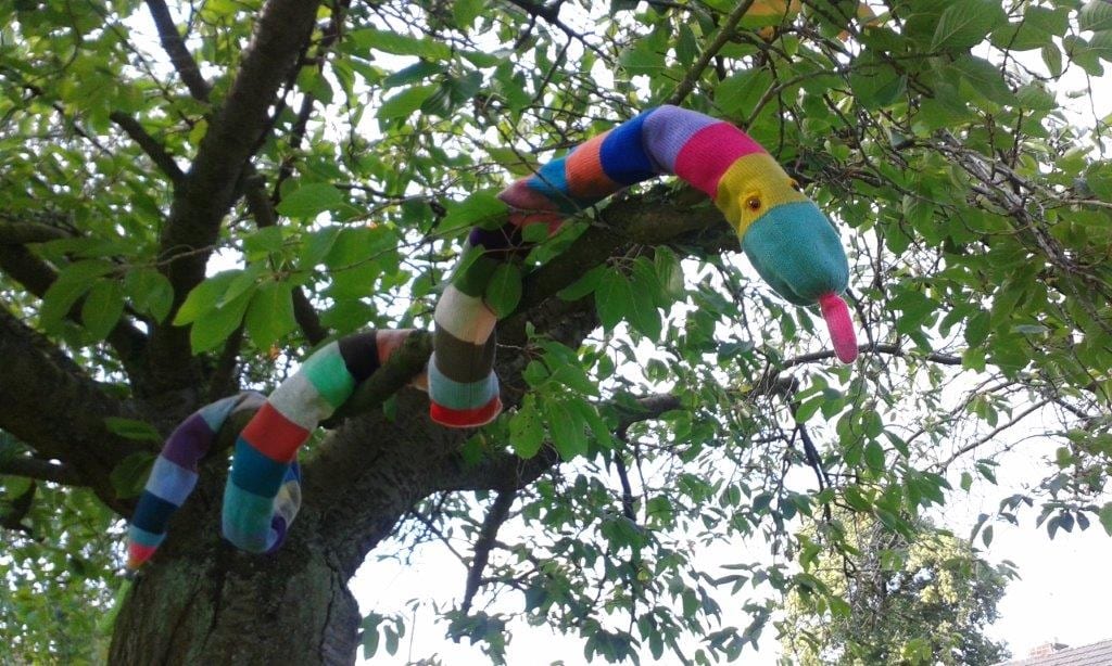 Knitted snake in a tree